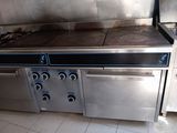 stainless steel counter top with four burners and four burners