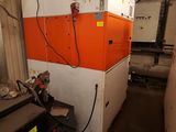 an orange and white machine that is in a building