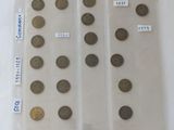 several different types of coins are displayed in a plastic case