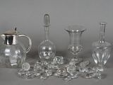 a lot of glass items that are sitting on a table