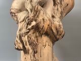 statue of a man with a lion ' s head on a pedestal