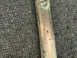 a close up of a piece of metal on the ground