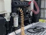 a hose attached to the back of a truck