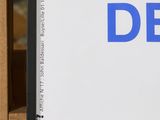 a picture of a sign that says debt on it