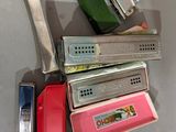 many different types of lighters and lighters on the table