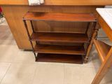 a wooden shelf that has a towel on top of it