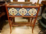 a wooden table with a painted flower design on it