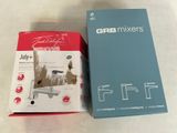 the box is open on the table next to the box of the mixer