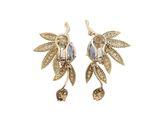 a pair of gold earrings with blue stones and leaves