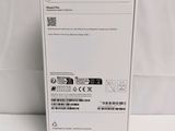 the back of a white box with a green sticker on it
