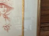 framed drawing of a woman in a hat with a feather on her head