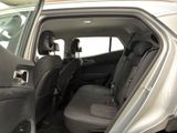 a car that has the door open and the passenger seat down