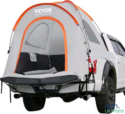 a truck with a tent attached to the back of it