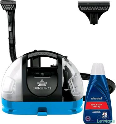 a blue and white steam cleaner and a bottle of cleaner