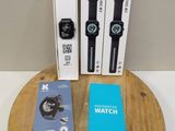 three watches sitting on top of a wooden table