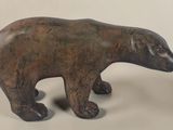 statue of a bear made of wood on a white background