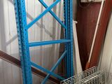 a metal rack that has a blue frame on top of it