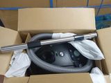 a box with a vacuum and a hose inside of it