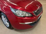 the red car is parked in the showroom in the showroom