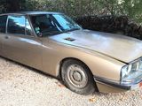 a car that is sitting in the gravel