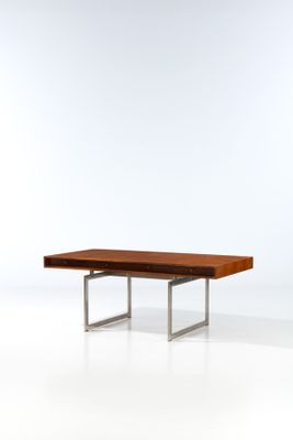 an image of a wooden table with metal legs and a wooden top