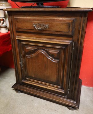 a wooden cabinet with a tv on top of it