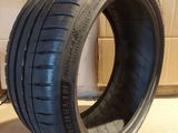 a close up of a tire that is on a cardboard box