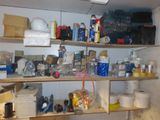 a room with a lot of clutter and supplies on the shelves