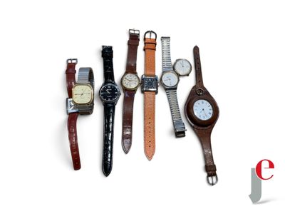 several different types of watches are lined up on a white surface