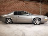 an image of a silver car parked in a garage