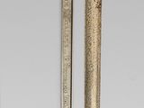 a metal object that is hanging on a wall