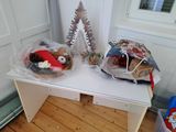two bags of toys sitting on a table in a room