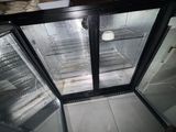an image of a refrigerator with a glass door in a kitchen