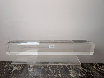 a glass shelf with a glass shelf on top of it
