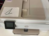 a printer sitting on top of a table in a room