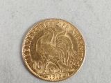 an image of a gold coin with a rooster on it