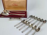 a lot of spoons in a case on the table