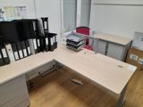 an image of a desk with a lot of files on it