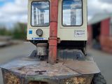 a small machine that is sitting in the middle of a parking lot