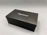 a close up of a black box with a white logo on it