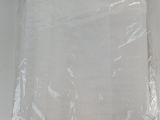 a plastic bag that has a white sheet on top of it