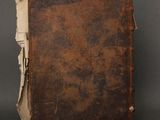 an old book that is sitting on top of a table