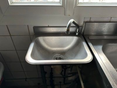 a sink and a window in a small room