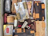 a box full of assorted items on the ground