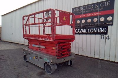 a picture of a red scissor parked in front of a building