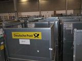 many metal bins in the warehouse with labels on them