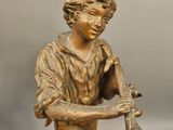 bronze figurine of a boy with a flute