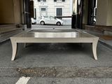 a table that is sitting in the middle of a parking lot
