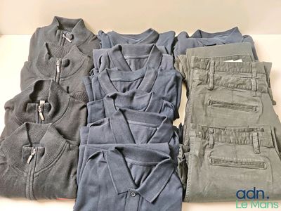 several pairs of men ' s clothing are laid out on a table