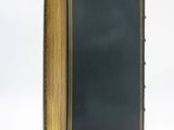 a close up of a book with a black cover on a white background